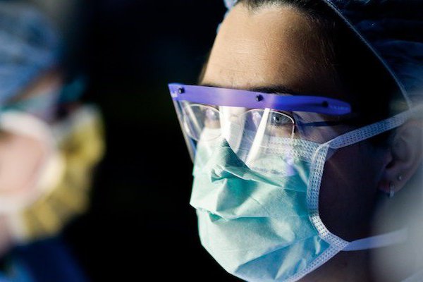 An image shows providers wearing masks.