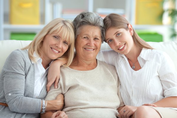 Group of three women posing for a picture