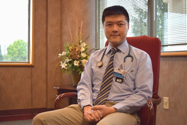 Dr. Adstam poses in his office.