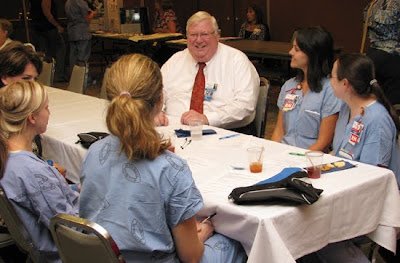 Bob Bezanson sits with nursing staff