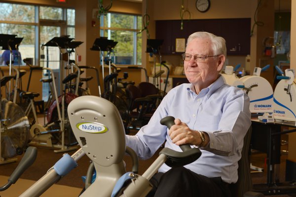 Bob Simmons is pictured exercising on a stationary bike.