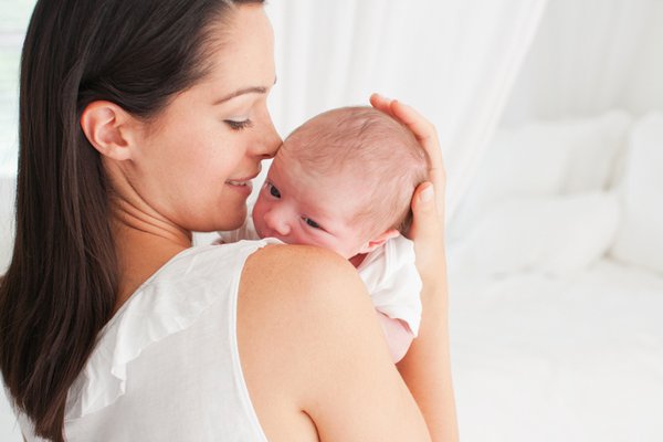 Woman holding newborn baby