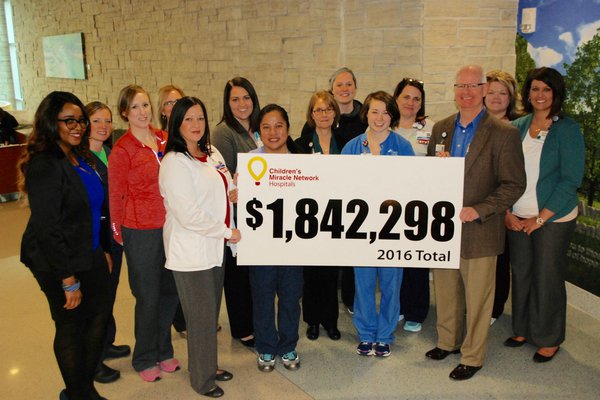 Group holds up total raised for Children's Miracle Network.