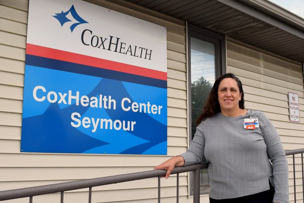 Jeanne Rodman stands in front of CoxHealth Center Seymour.