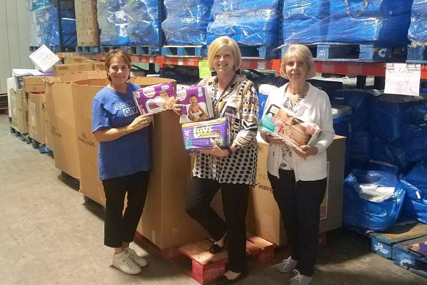 Brenda Jackson, Donyta Upton and Jill Bright pose at Diaper Bank of the Ozarks.