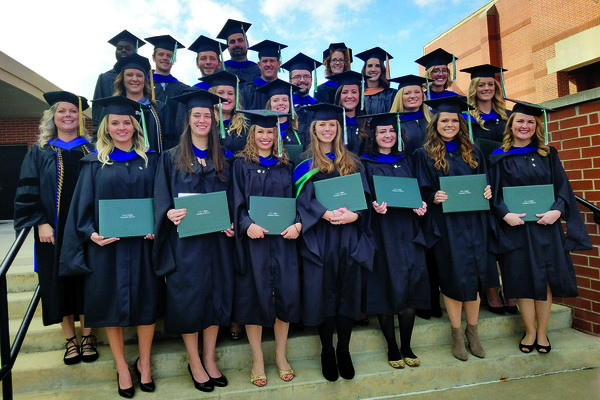 Cox College's first MSOT graduating class pose after the ceremony.