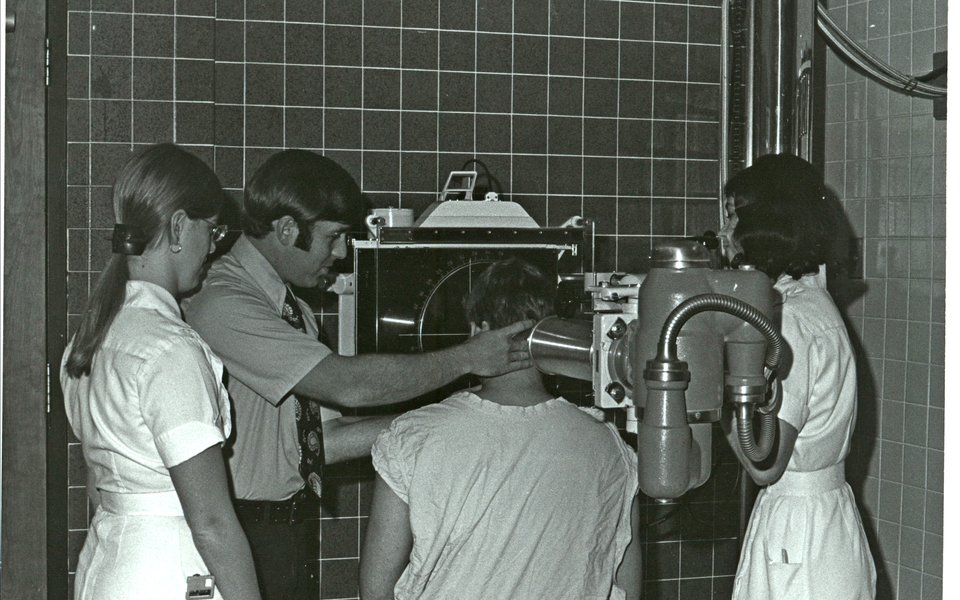 A historic photo of an eye exam at CoxHealth