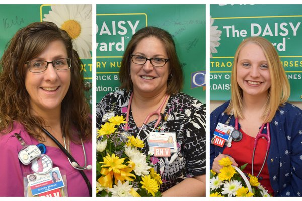 Springfield nurses winning DAISY awards pose for pictures.