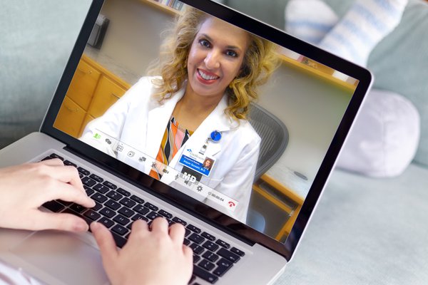 Patient video chatting with their doctor on the computer