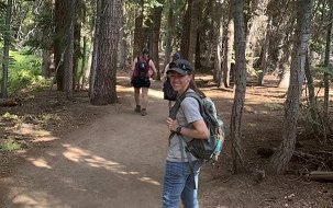 Dr. Michelle Smith hiking in woods