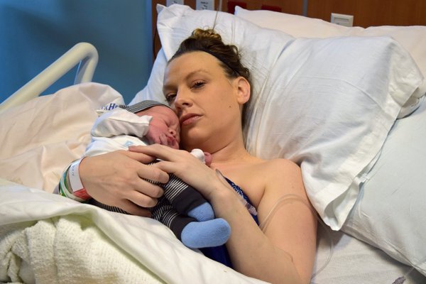 Darcy Wilson holds her new baby, Waylon.