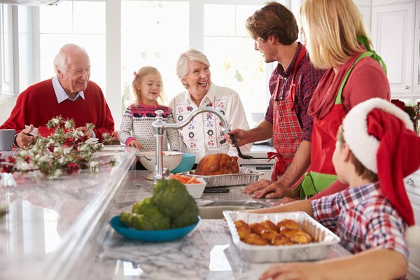 Family in the kitchen enjoying a festive dinner