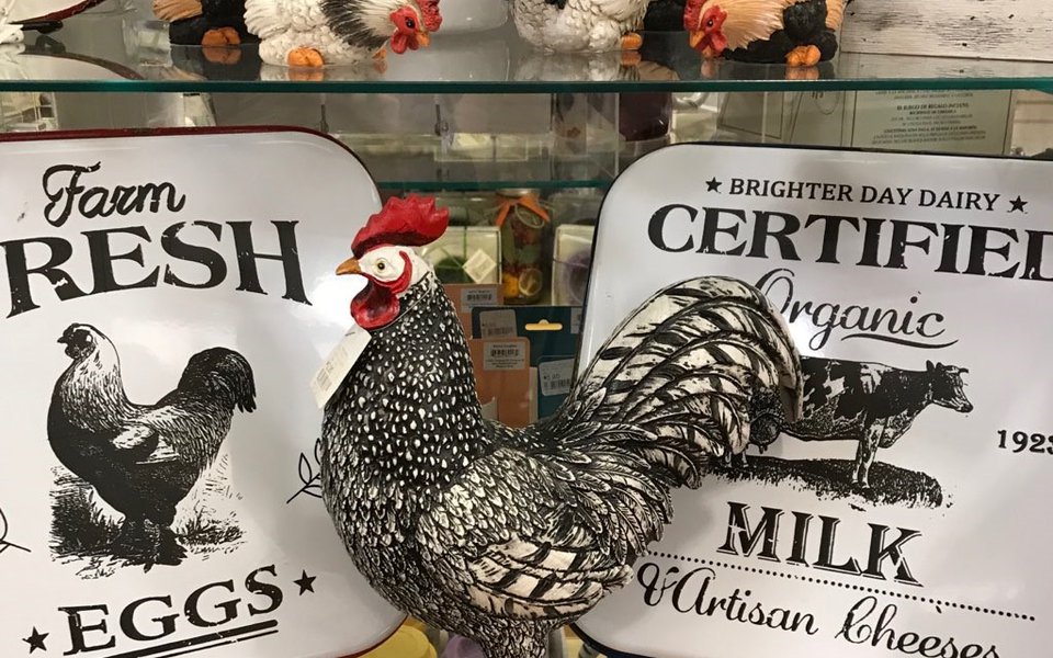 A metal rooster on display at the gift shop