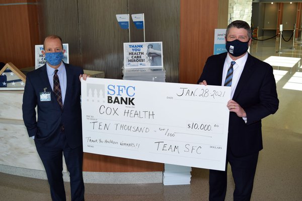 An image shows a check presentation from SFC Bank.