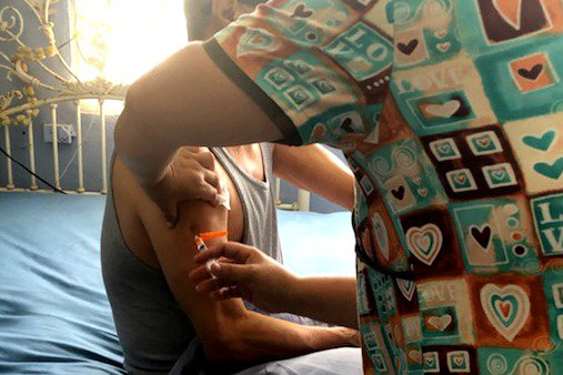 A patient receives a flu vaccine.