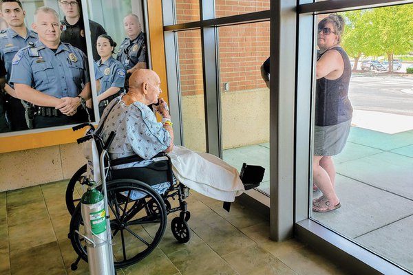 A patient does a window visit with family