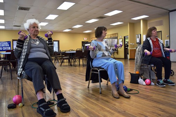 Seniors are exercising with their new equipment.