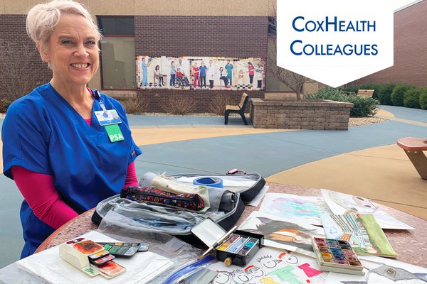 CoxHealth PSA Elisa Kruger sits with her paintings