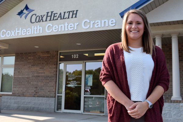 Lydia Reinhold standing outside her new clinic