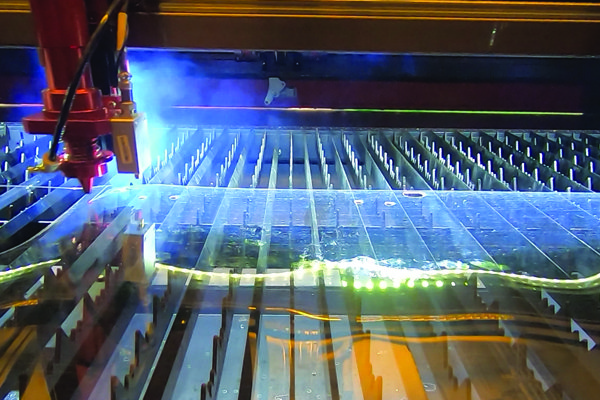 A photo shows items being created with a LASER.