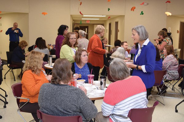 Group of workers eat in the cafeteria