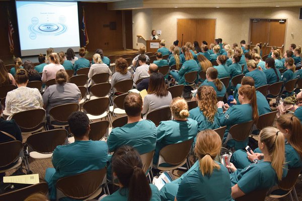 Group of Cox Health employees watching a presentation