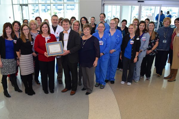 CoxHealth's team poses with its Show-Me 5 certificate.