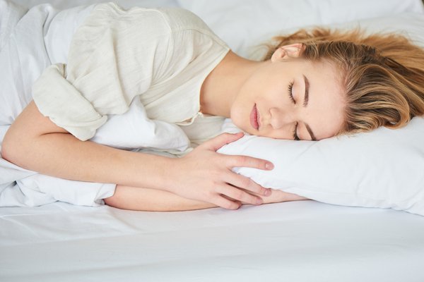 Woman in bed sleeping.