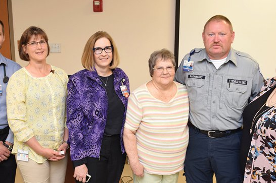 Tina King stands with a group of caregivers.