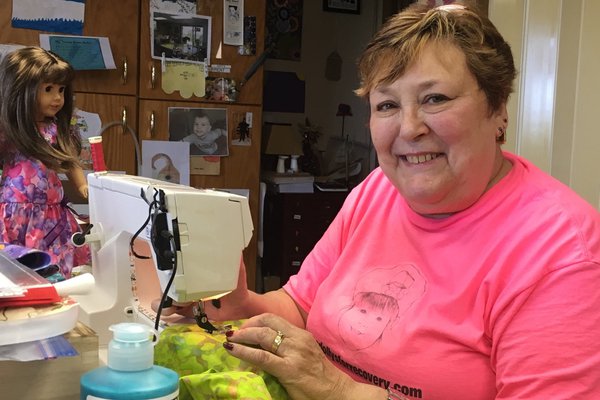 Nina Fournier making dolls