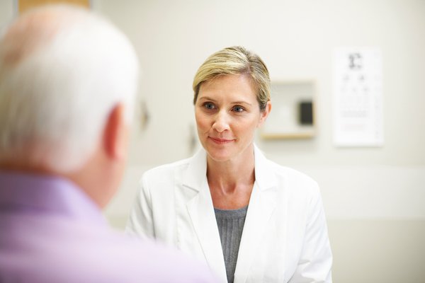 A provider speaks with a patient.